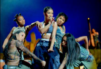 a group of women performing on stage